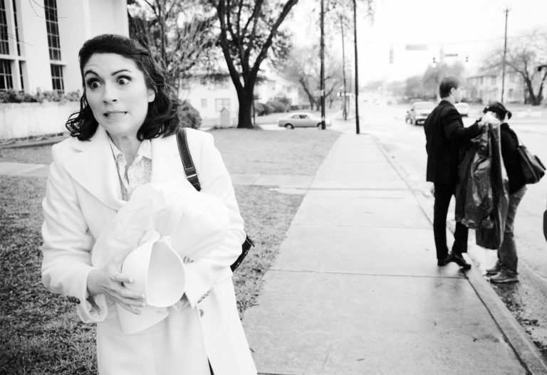 Susan the bride arrives at church with a newvous look eteched across her face San Antonio wedding photography by Philip Thomas