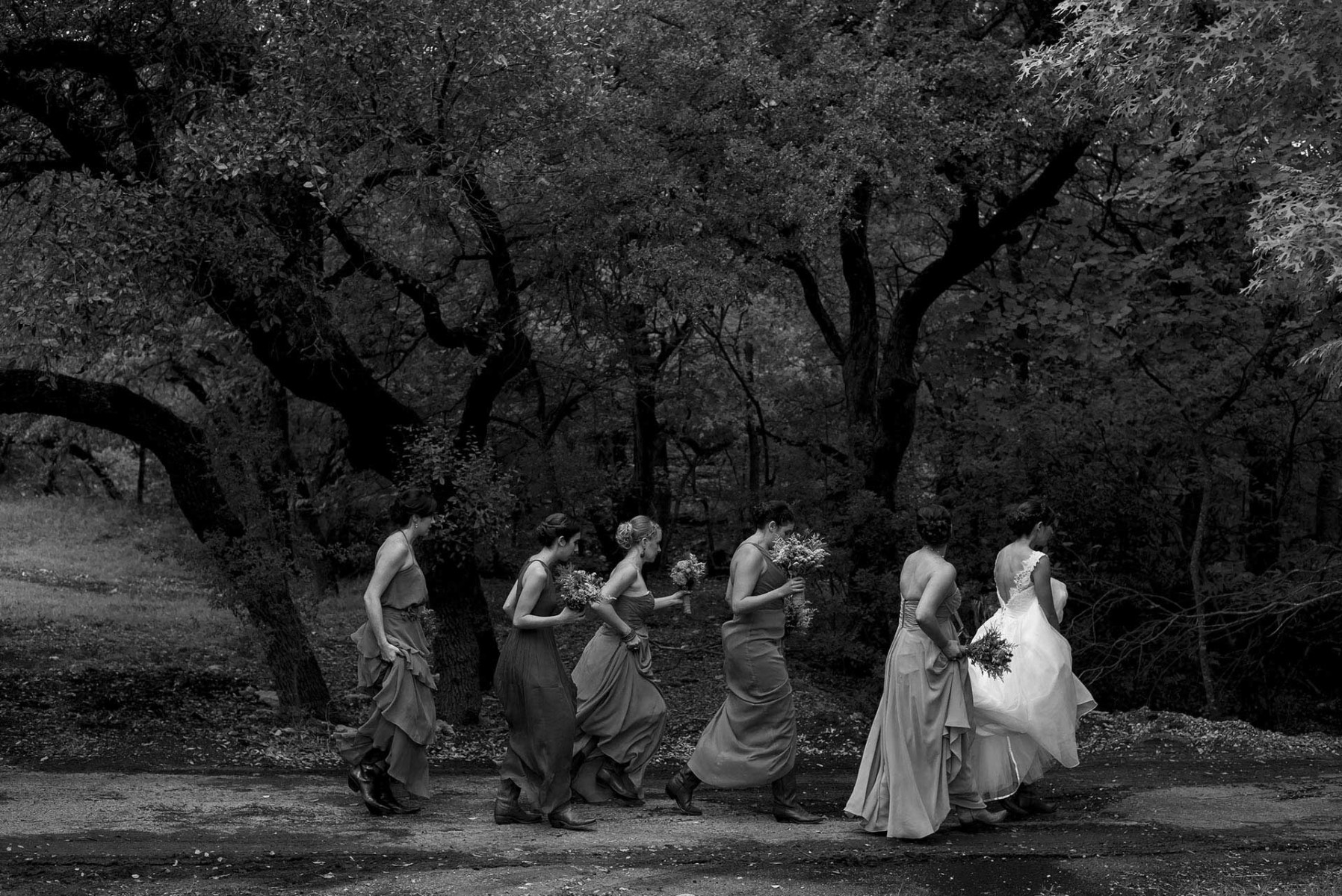 San Antonio wedding photographer Philip Thomas captures Bridesmaids and bride walking to ceremony in a Hill Country Wedding