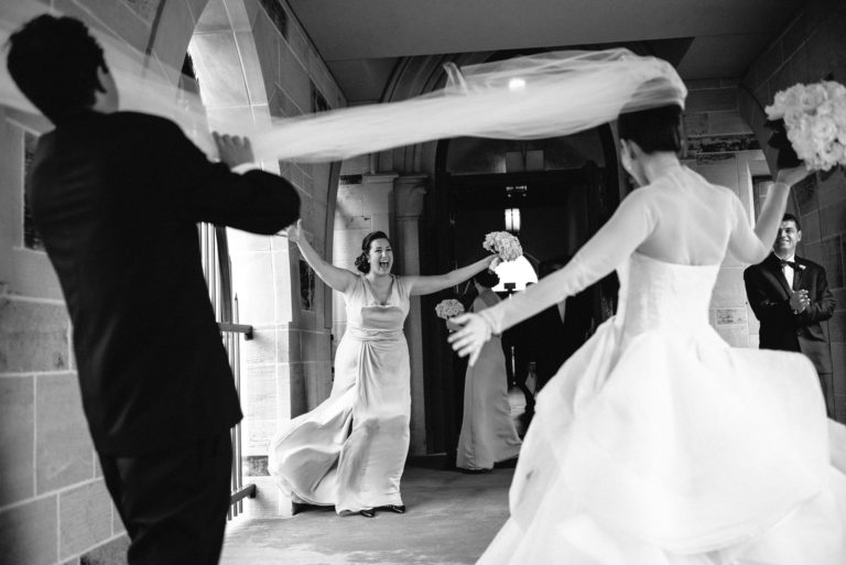 Exterior of the Holy Rosary in Houston, Texas, sister of the bride celebrates after tying the knot.