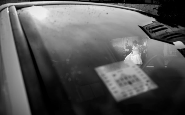 Wedded couple depart San Fernando Cathedral toward limo, San Antonio