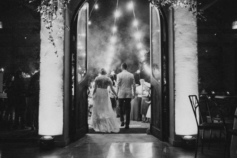 San Antonio wedding photographers and WPJA award winning images Couple-exit-wedding-reception-with-sparklers-at-Barr-Mansion-in-Austin-Texas-photographed-with-a-Leica-M10-and-35mm-summilux-by-Philip-Thomas