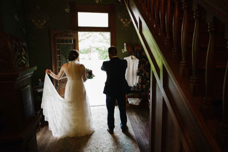 Bride photographed at Barr Mansion in Austin as she waits pre ceremony with her father