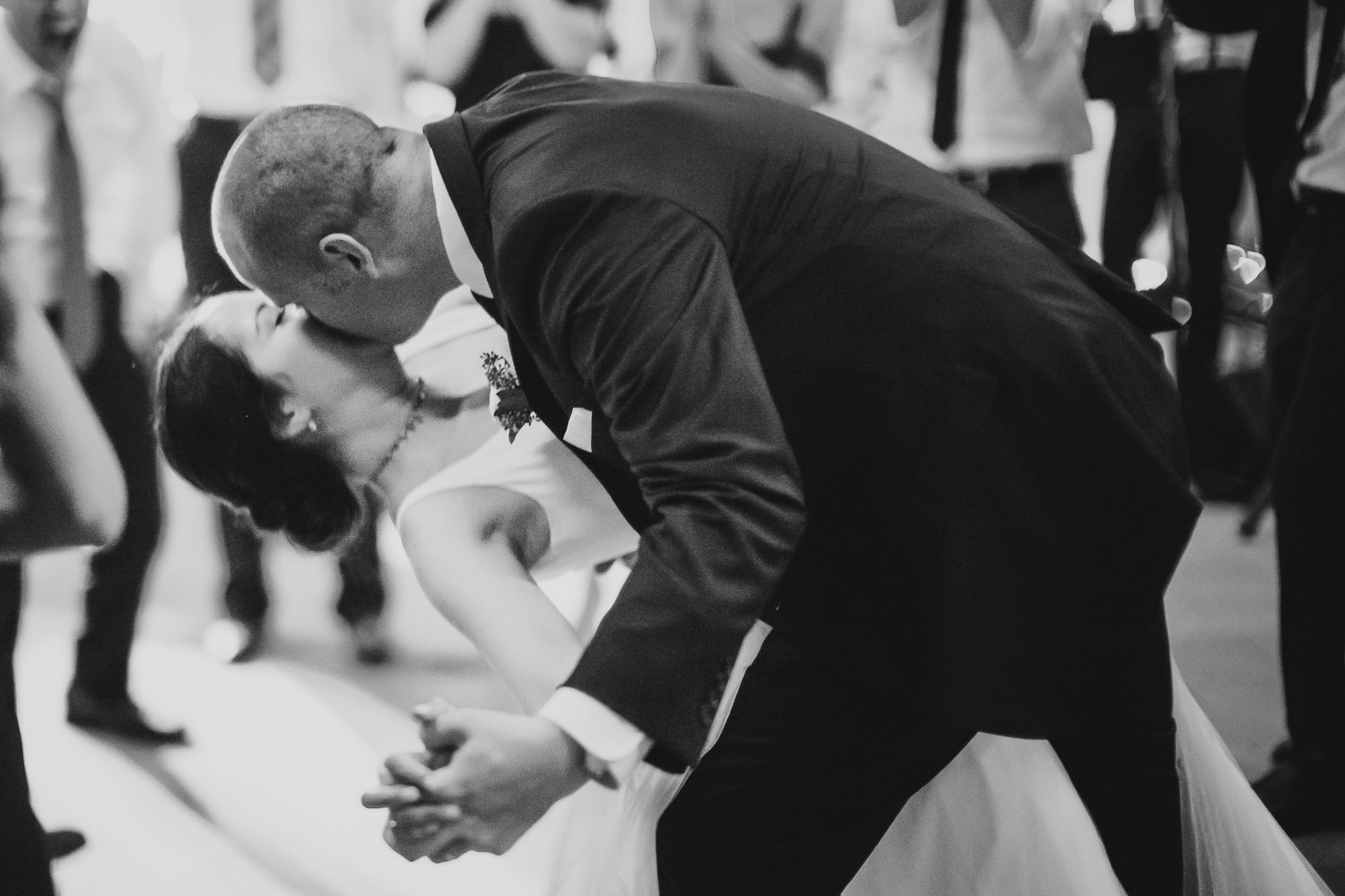 Groom lowers bride for a kiss on dance floor reception Cherie Flores Garden Pavilion Wedding Hermann Park Houston Texas-Philip Thomas