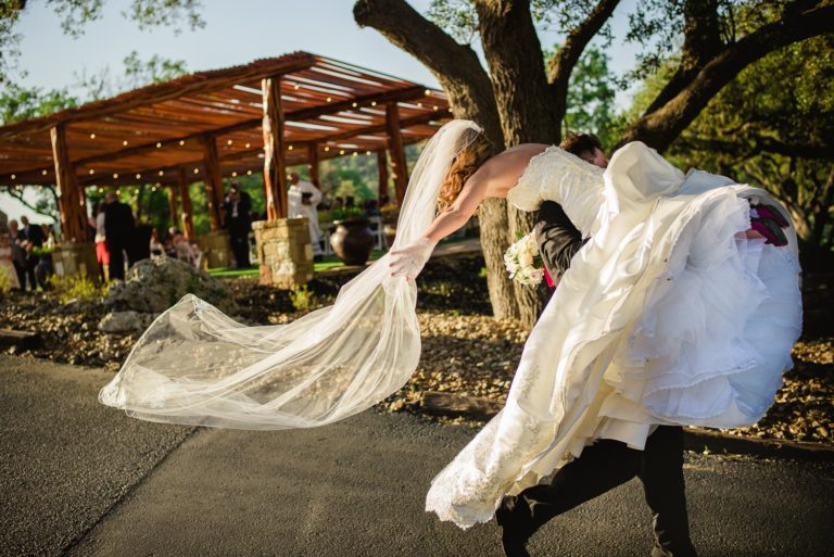 Bride-lifted-into-air-by-groom-at-Tapatio-Springs-Texas