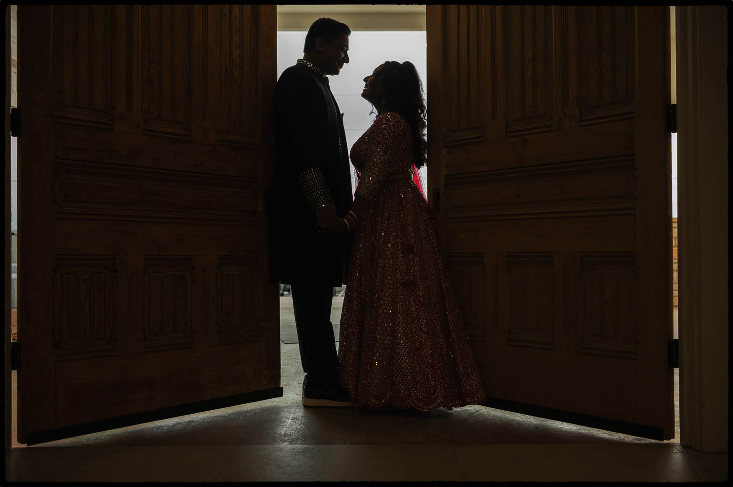 a man and woman standing in a doorway
