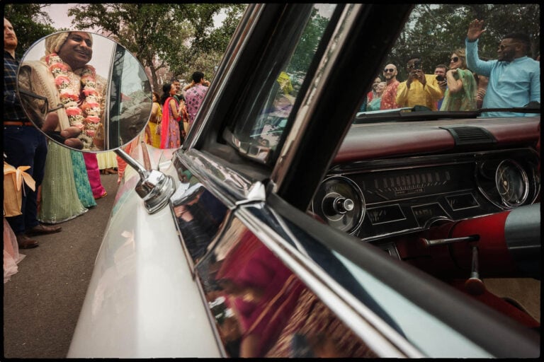 A Groom in a car during The Baraat 047 The Videre Estate South Asian Wedding in Wimberley Texas Philip Thomas wedding photographer L1080152 Edit