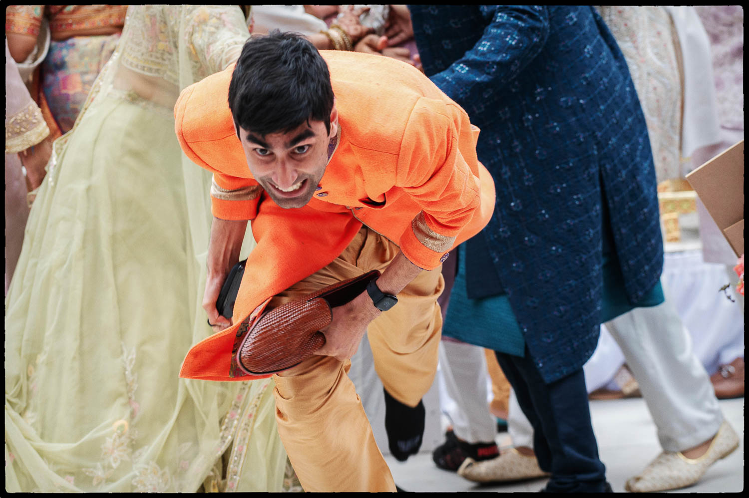 a man in an orange suit kicking a man in an orange suit
