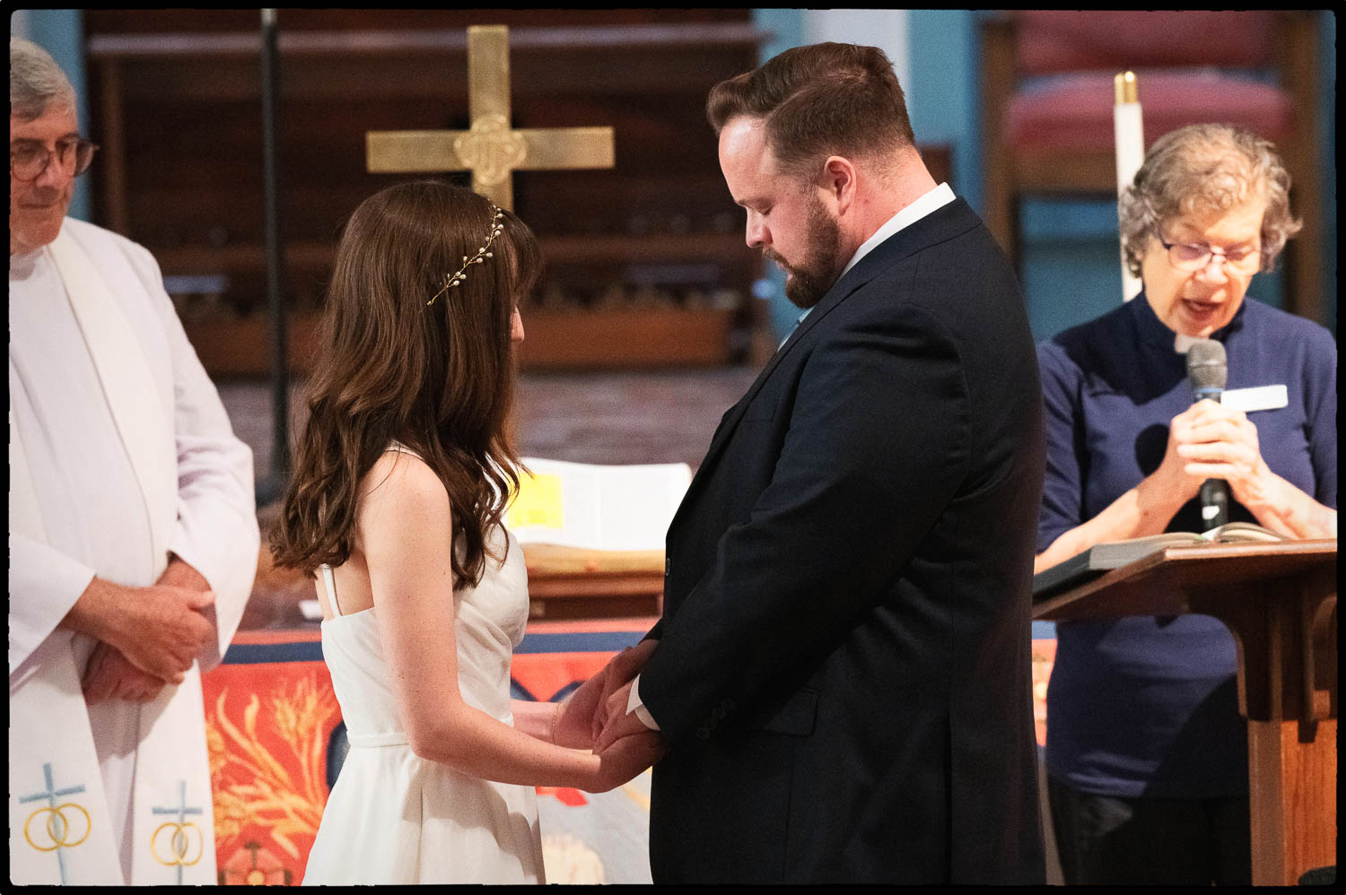 a man and woman holding hands 11 Elopement Wedding Ceremony Travis Park Church Philip Thomas wedding photographer DSC 4565 Edit