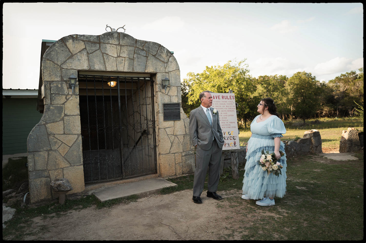 a father of the bride and daughter standing at the entrance to Cave Without A Name