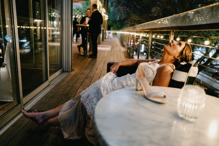 A bride takes a welcome break to change her shoes at The Grove in Houston Texas - L1042645 Enhanced NR Edit L1042645 Edit