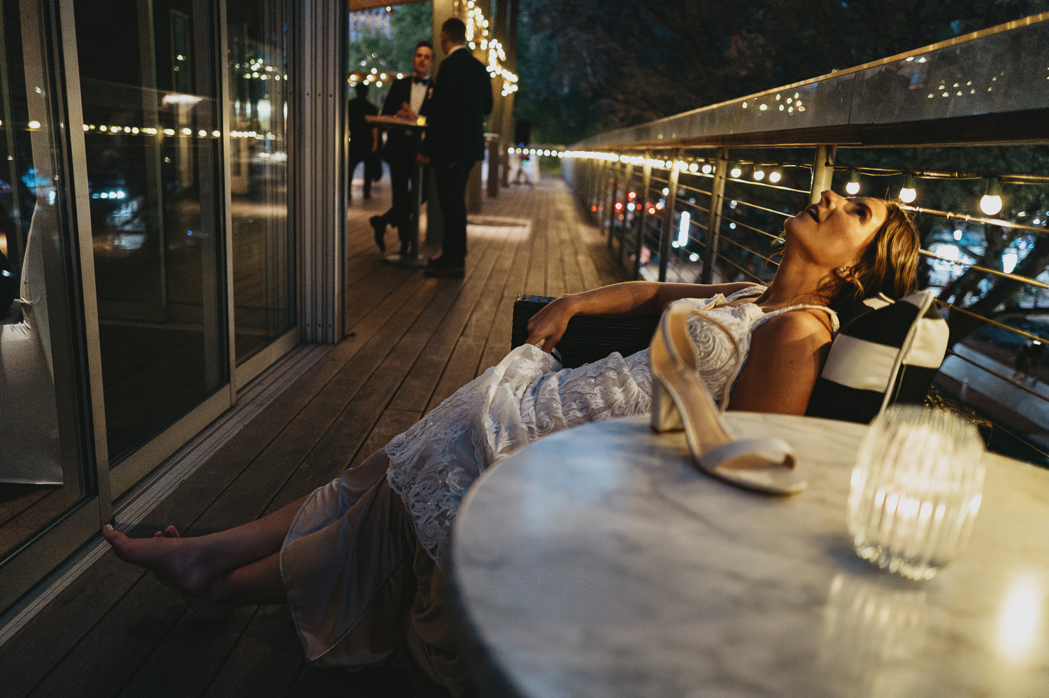 Bride takes a moment to soak it all in during a wedding reception L1042645-Philip Thomas